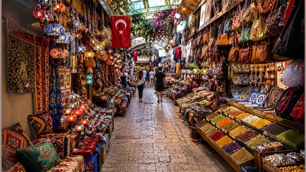 A bustling market with colorful textiles, intricate lanterns, and a variety of spices. 2