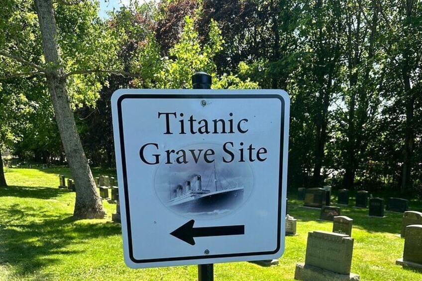 A sign for the Titanic Grave Site with an arrow pointing left. 3
