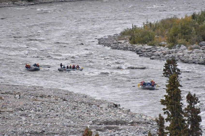 A river with multiple inflatable rafts. 4