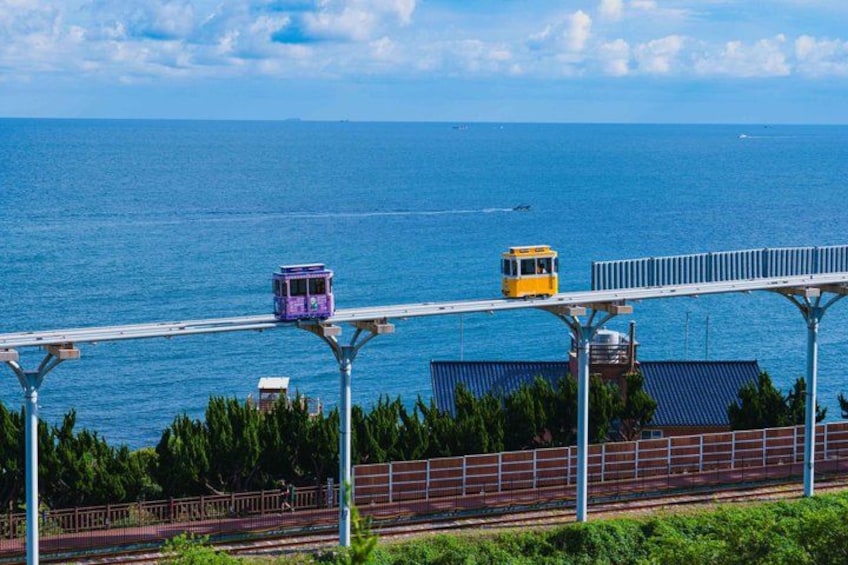 A cable car system over a body of water with a clear sky. 4