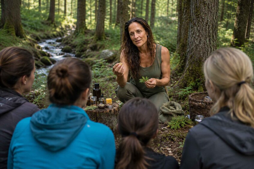 A group of people in a forest with a stream, engaged in a discussion around a campfire. 2