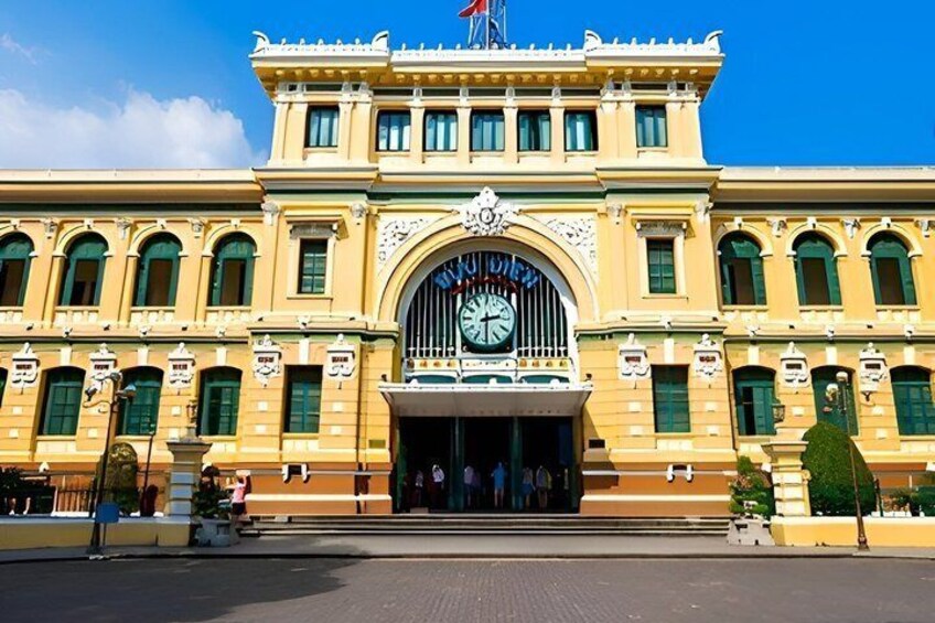 A large, ornate building with a prominent clock and arched entrance. 1
