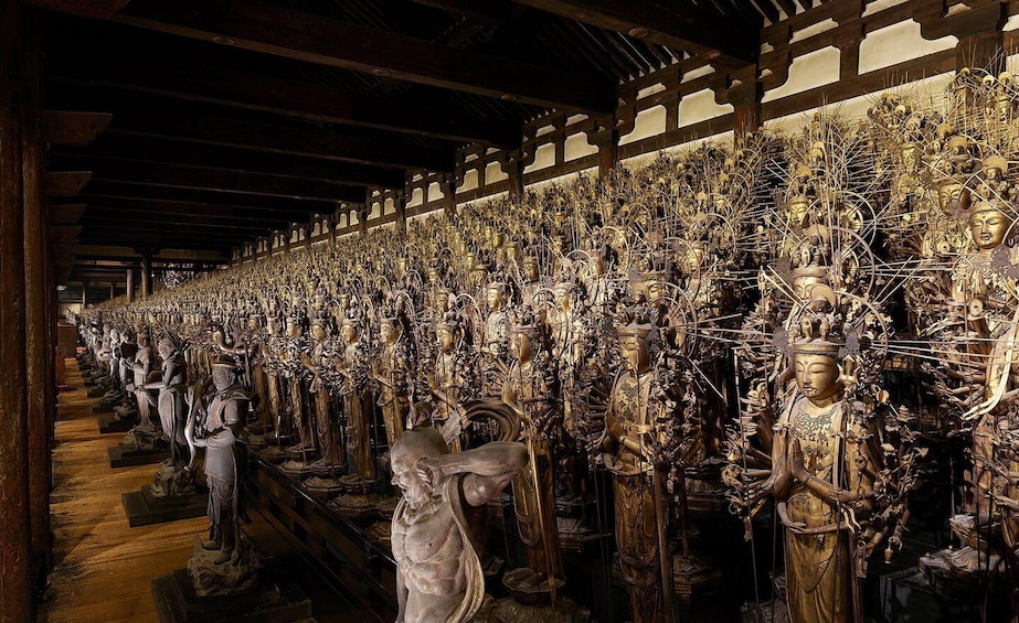 A long gallery of intricately carved statues in a temple. 1