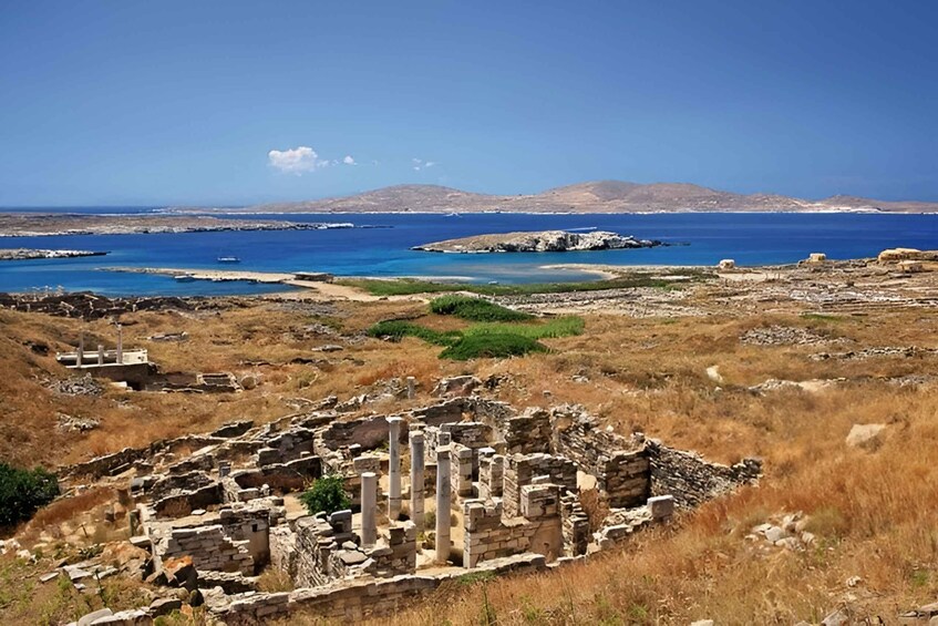 Ancient ruins, a coastal landscape, and distant mountains. 2