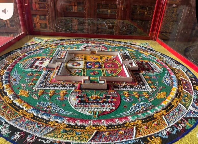 A detailed, colorful carpet with intricate patterns and a central square design. 1
