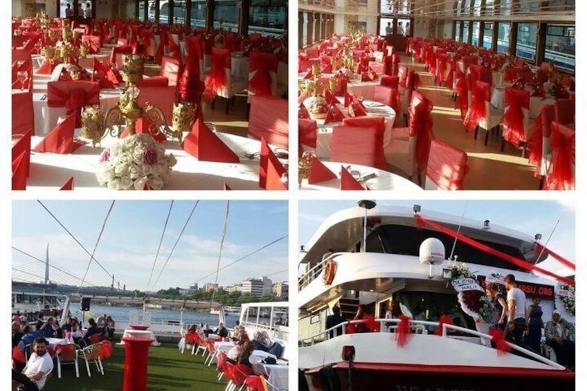 A boat with red decorations and tables set up on the deck. 5
