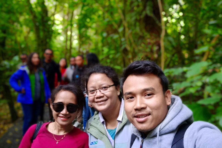 A group of people in a forested area. 5