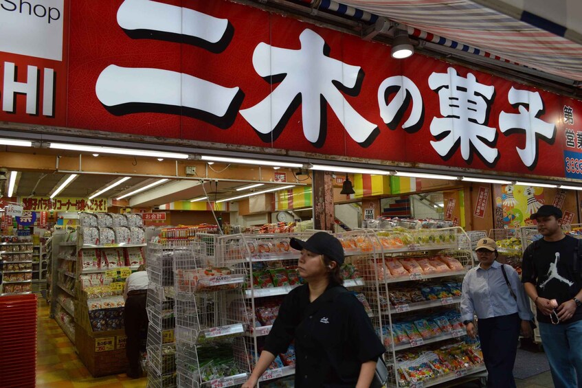 A grocery store aisle with various packaged goods on shelves. 4