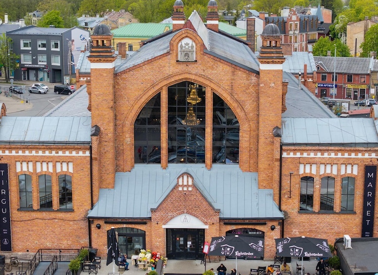 A historic building with a large arched window and brick facade. 2