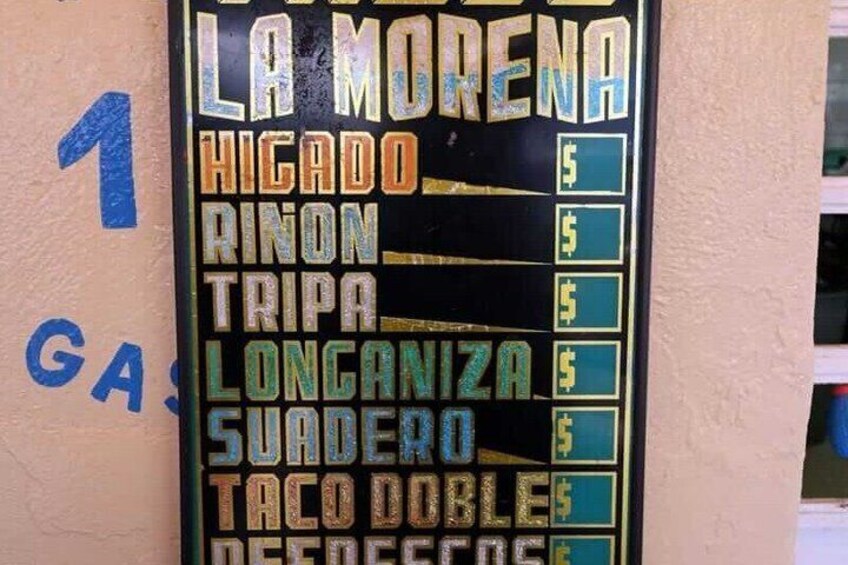 A menu board with items like 'La Morena,' 'Hicado,' 'Rinón,' 'Tripa,' 'Longaniza,' 'Suadero,' and 'Taco Doubles.' 2