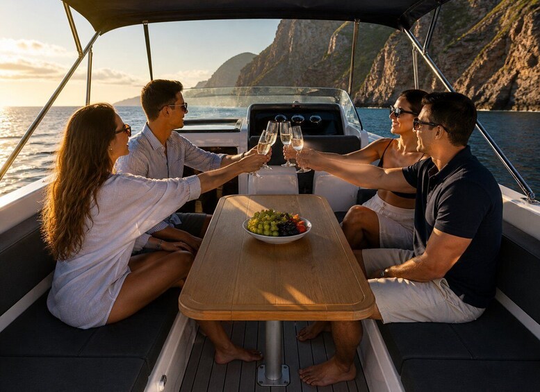 A group of people toasting with champagne on a boat with a rocky coastline in the background. 2