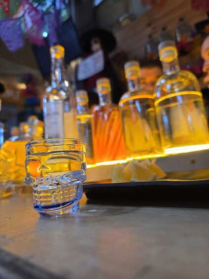 A bar with bottles and a glass. 1