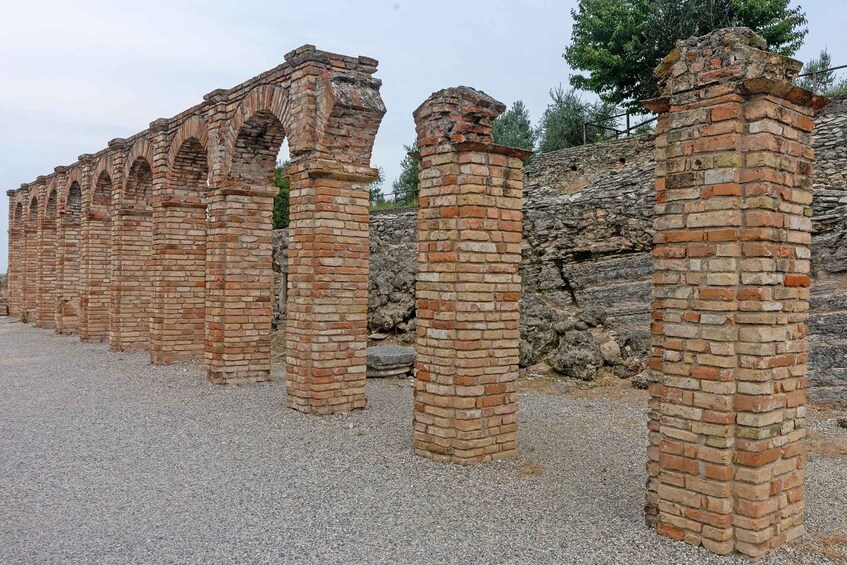 Ancient brick ruins with arches and columns. 3