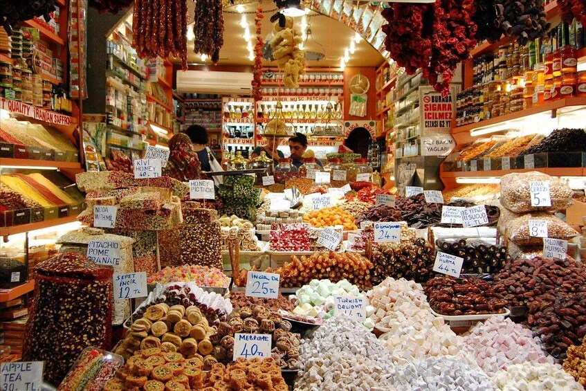 A market with various food items and spices on display. 4