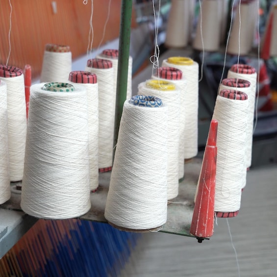 Spools of thread hanging on a rack. 2