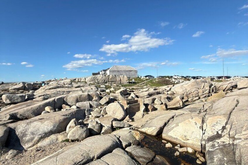A rocky landscape with large boulders and a dome-shaped structure. 2