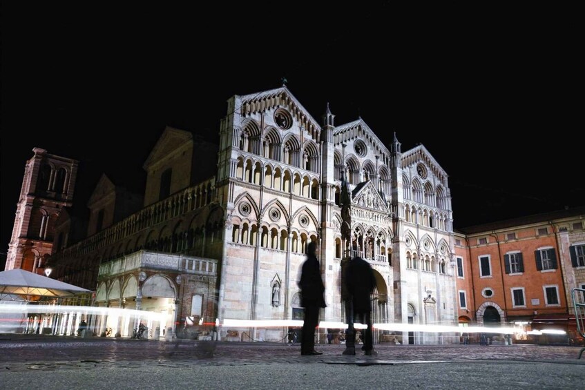 A historic cathedral with intricate Gothic architecture, a prominent bell tower, and a cobblestone square. 3