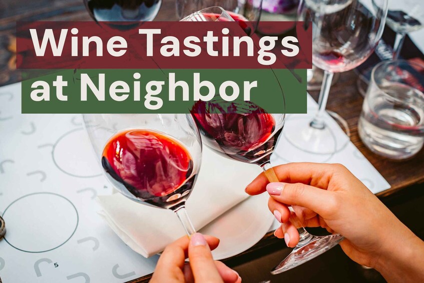 A wine tasting event with glasses of red wine on a table. 1