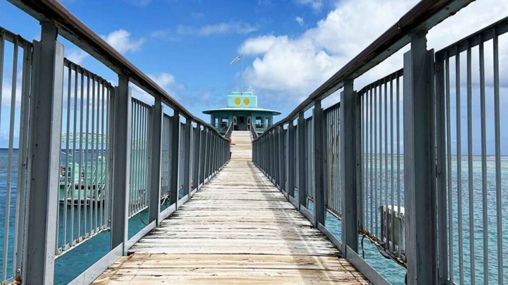 A wooden pier leading to a lighthouse. 2