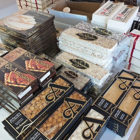 A variety of packaged food items, including boxed chocolates and cookies, displayed in a store. 5