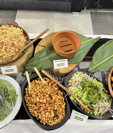 A variety of food items displayed on a table with labels indicating different dishes. 3