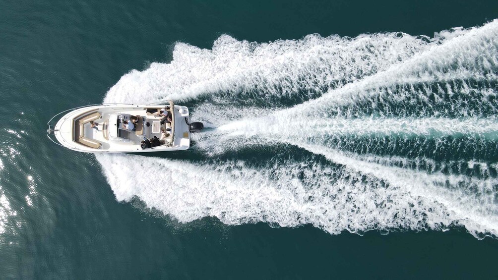 A speedboat creating a wake in the water. 3