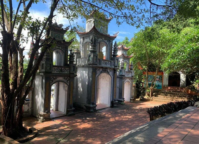A traditional temple with ornate architecture, surrounded by lush greenery. 2