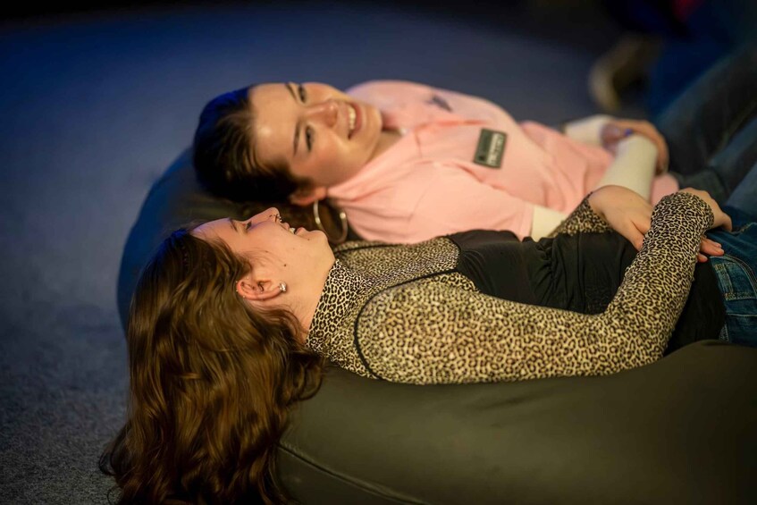 Two people lying on a couch. 5
