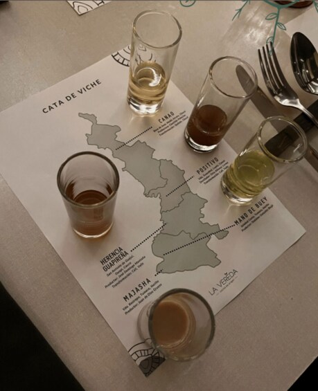 A menu with a map of Spain and glasses of wine. 1