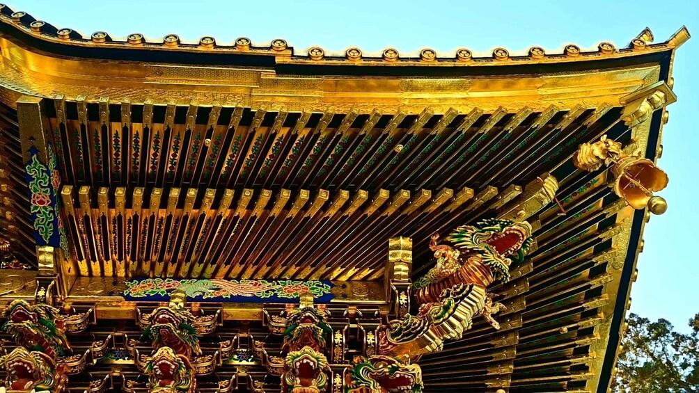 A golden pagoda with intricate designs and lion statues. 5