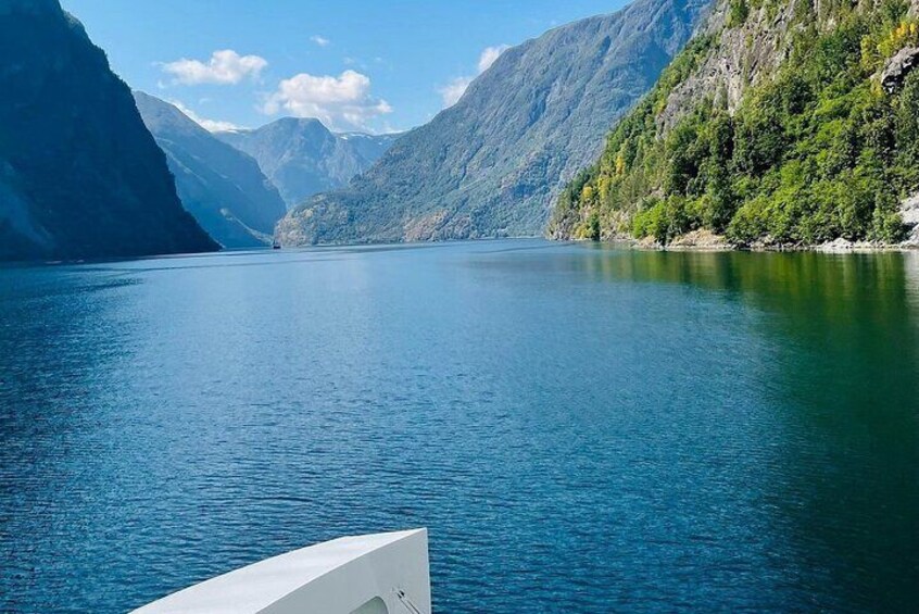 A calm lake surrounded by mountains. 3
