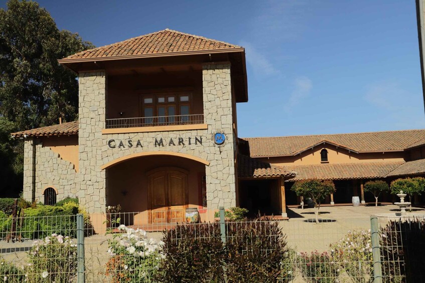 A stone building with a sign reading 'CASA MARIN.' 3