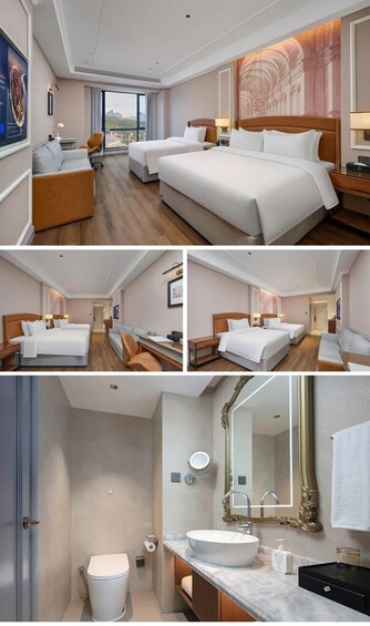 Una camera d'albergo con un letto grande, una scrivania e un bagno con lavandino e specchio. 5