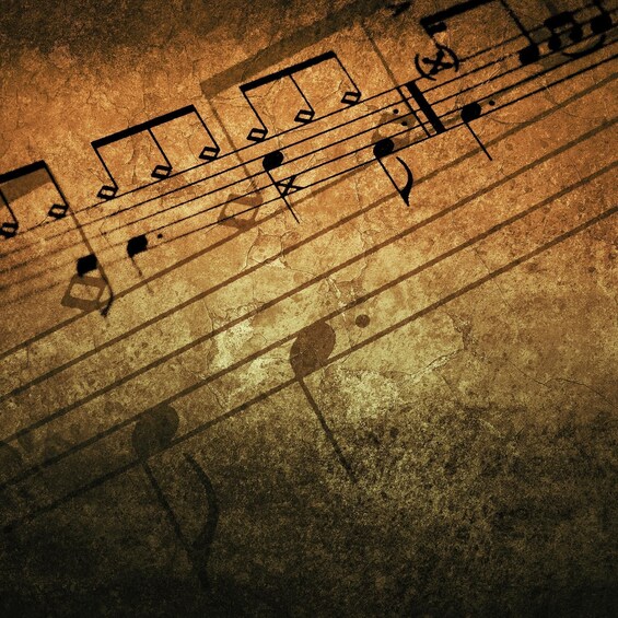 A close-up of sheet music with musical notes and clefs. 2