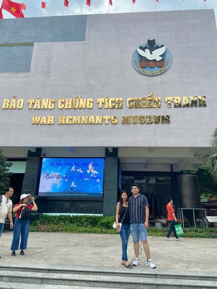 The entrance to the War Remnants Museum with a large sign and a digital display. 5