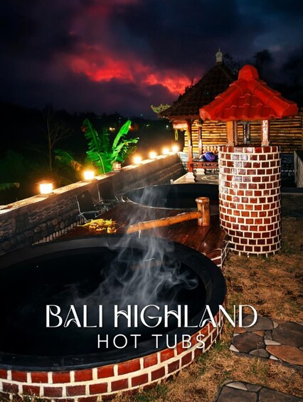 A hot tub area with brick structures and a red-roofed pavilion at night. 5