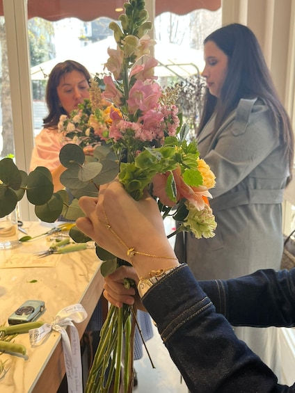 A person holding a bouquet of flowers. 5