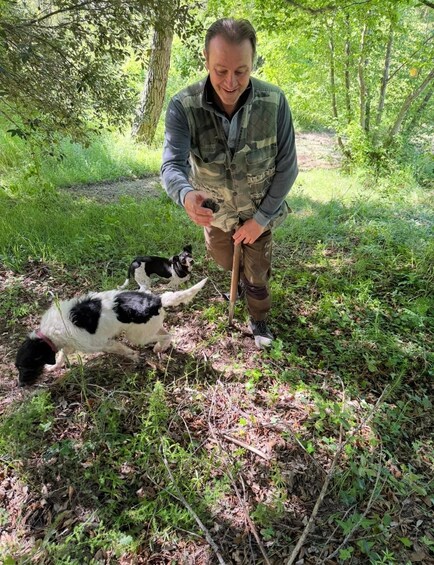 A person in a forest with a dog. 2