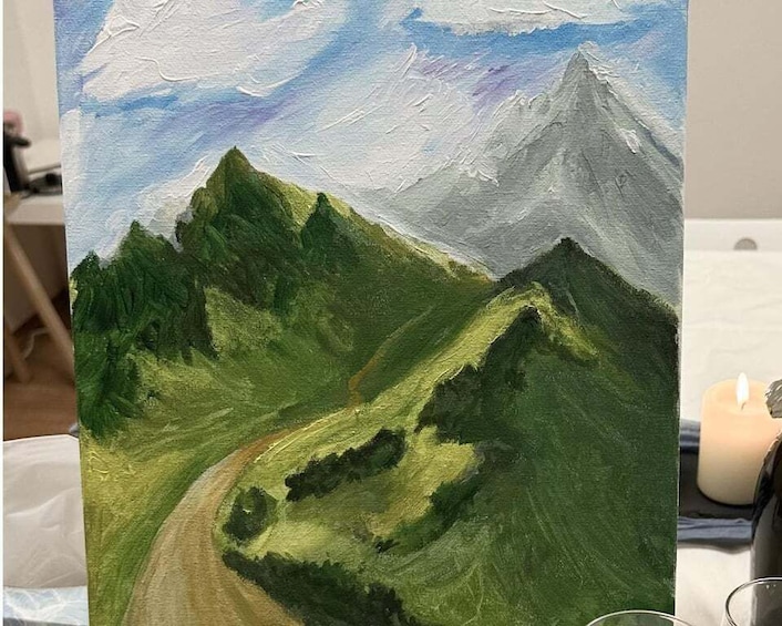 A landscape painting of a mountain range with a winding road. 2