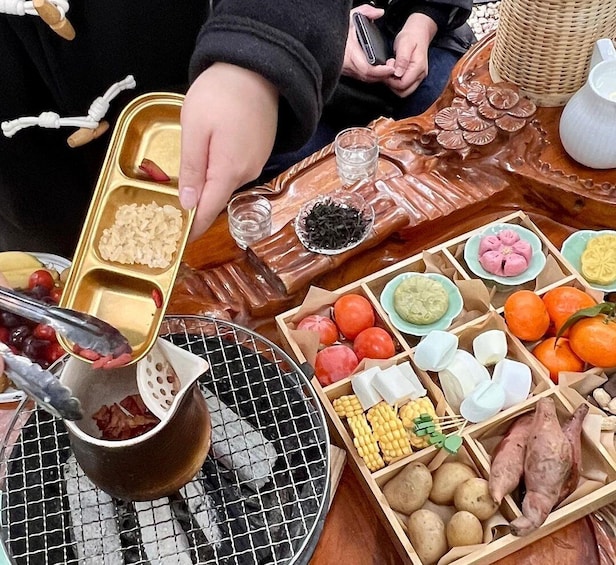 A variety of food items on a table, including fruits, vegetables, and a grill. 3