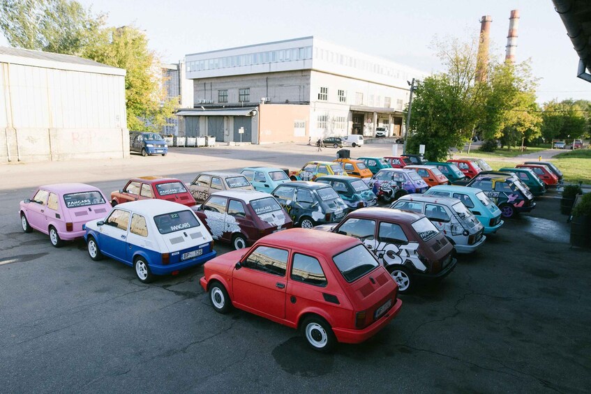 A parking lot with various vintage cars. 1