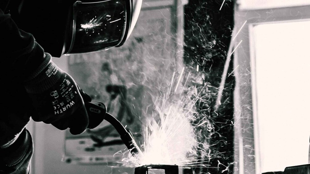A person welding with sparks flying. 5