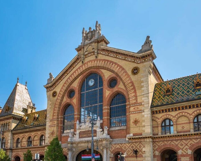 A historic building with arched windows and a clock tower. 3