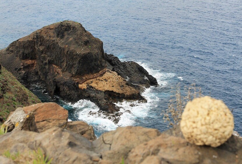 A rocky coastline with waves crashing against the rocks. 3