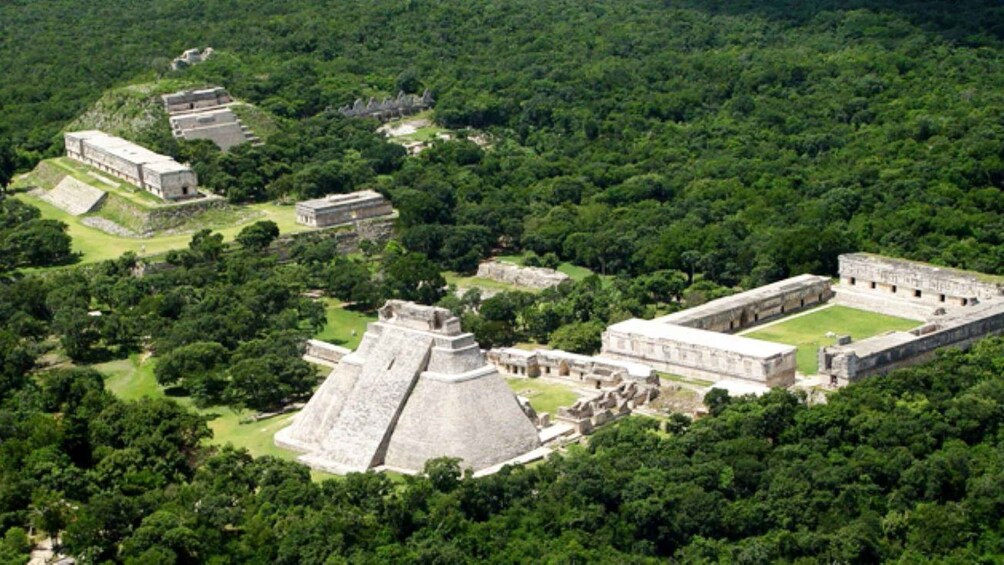 An ancient Mayan city with pyramid structures and dense forest. 3