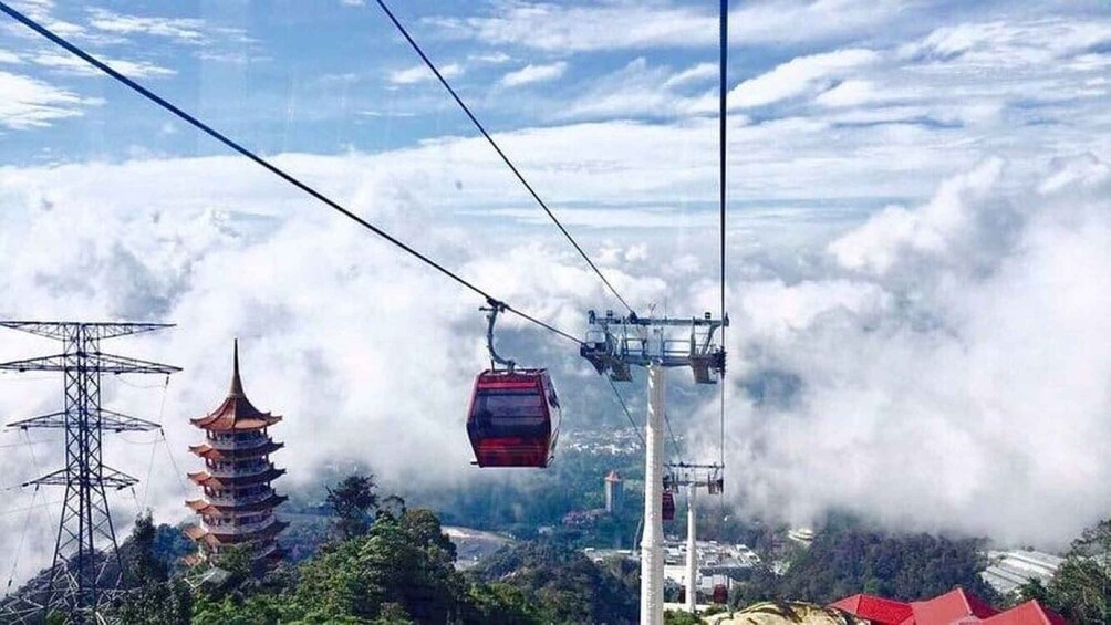A cable car system, a pagoda, and a power line tower amidst clouds. 3
