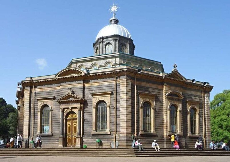 A historic building with a dome and arched windows. 1
