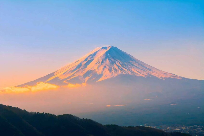 A snow-capped mountain with a clear sky. 5