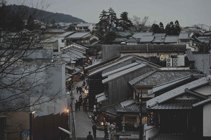 A traditional Japanese town with narrow streets and wooden buildings. 5
