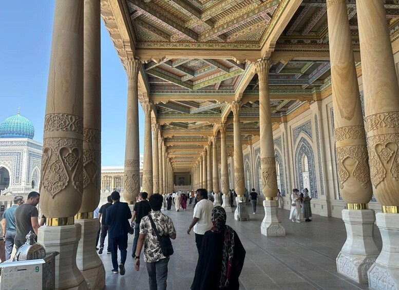 A grand architectural space with ornate columns and a patterned ceiling, likely a historical or religious site. 2
